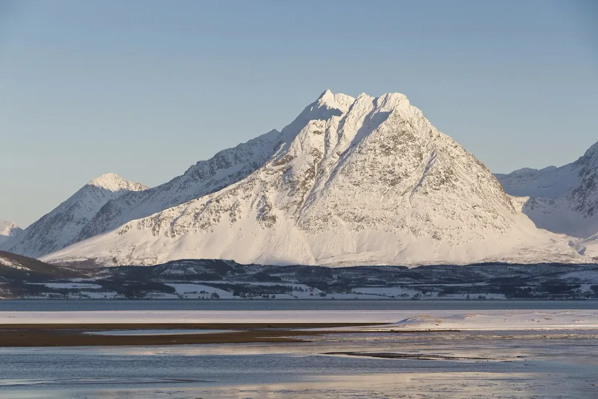 Trollvasstinden in the Lyngen Alps seen across Ullsfjorden from Breivikeidet, the view on husky dog sledding from Tromsø